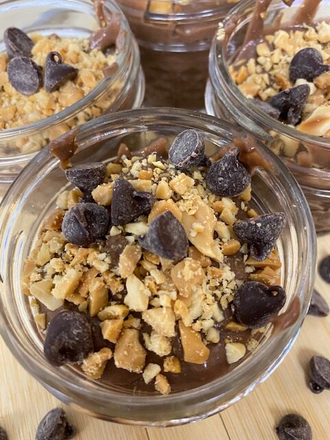 Quick Chocolate Peanut Butter Pudding in glass jars.