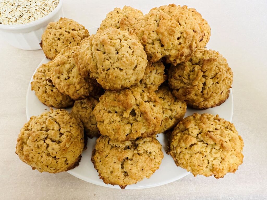 Cookies stacked on white plate.