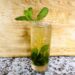 Mint Julep in clear glass with mint sprigs as garnish.