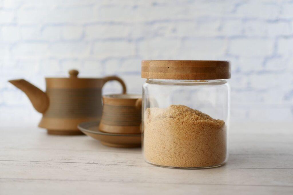 Brown Sugar in clear jar with wooden lid.