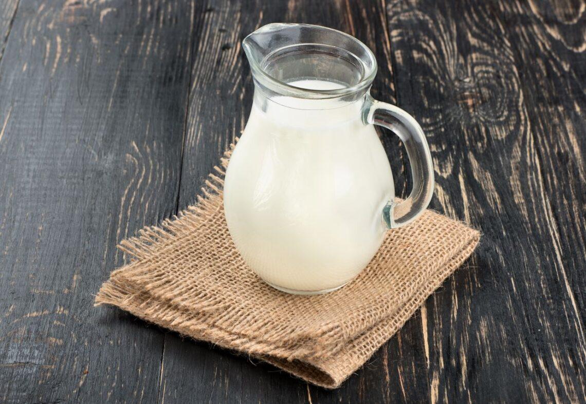 Heavy cream in clear pitcher.