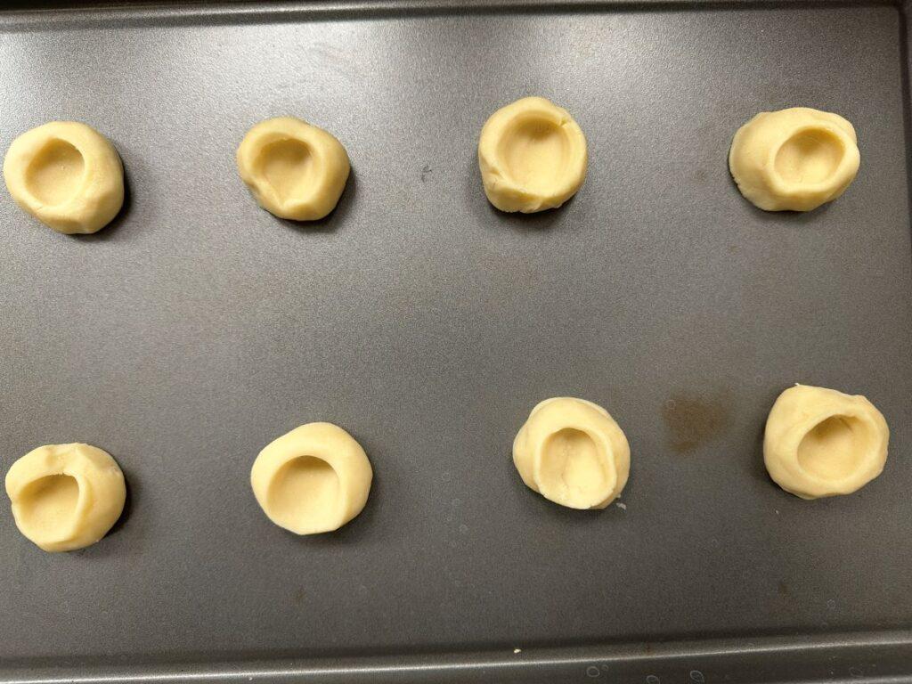 Lemon puff cookie dough on cookie sheet before going in the oven.