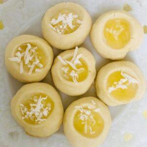 Lemon puff cookies on white plate.