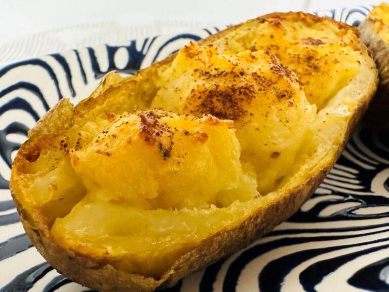 Close up of stuffed baked potato.