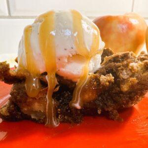 Close up of apple bar with vanilla ice cream and caramel drizzle on top.