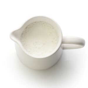 Milk in white jug.