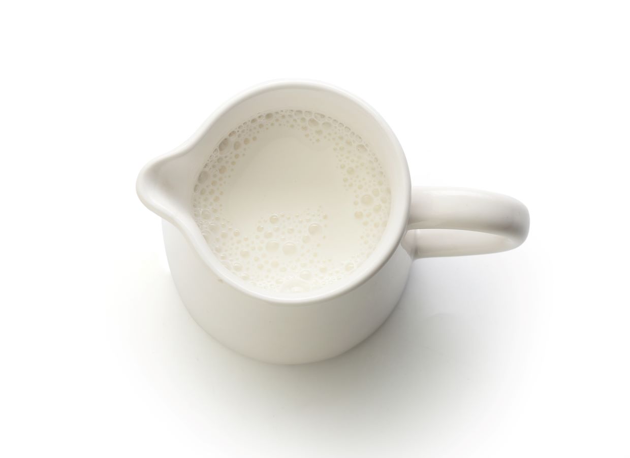 Milk in white jug.