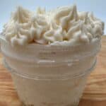 White frosting in clear glass jar.