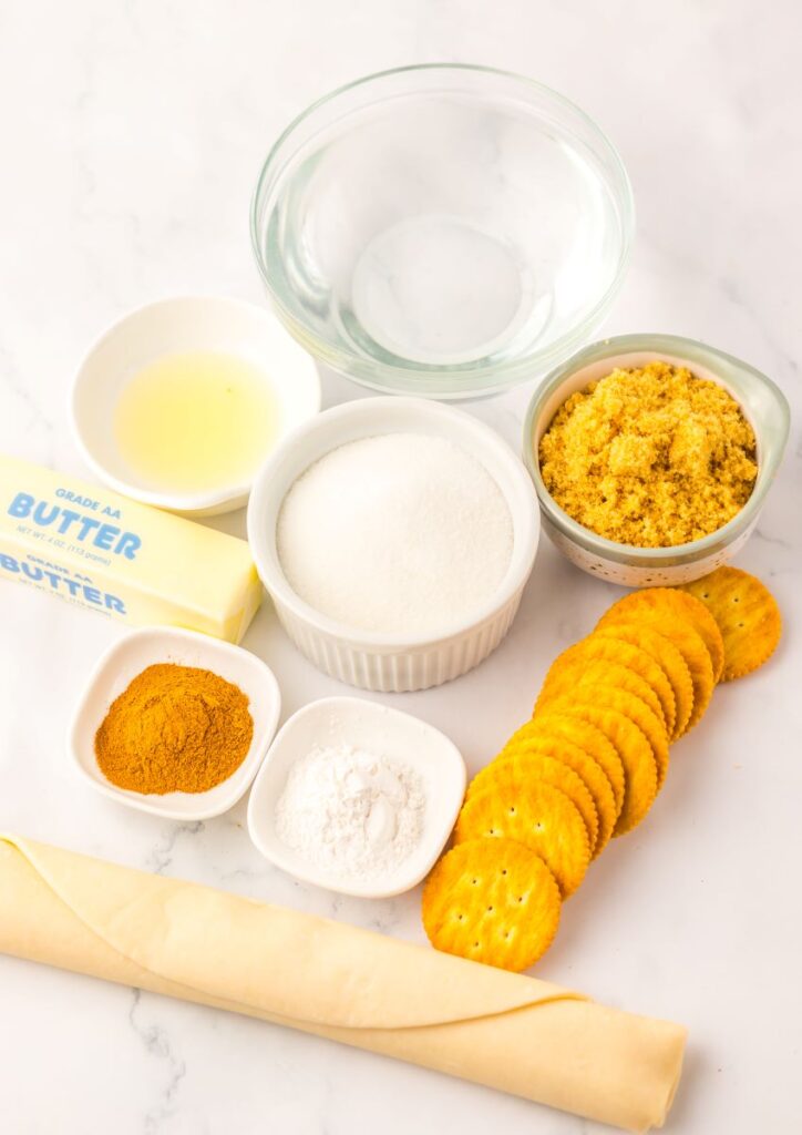 Ingredients for mock apple pie on white background.
