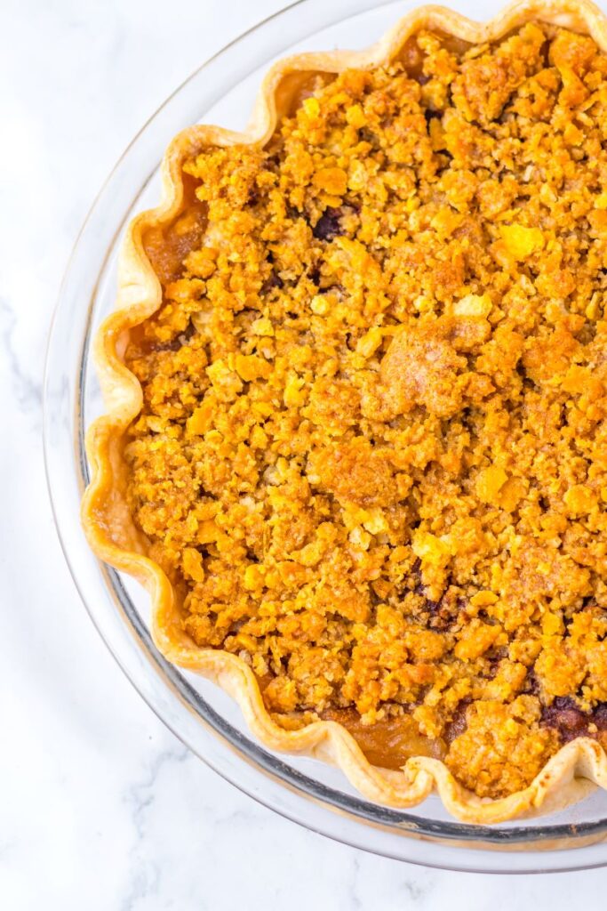 View of half of a pie in glass pie dish.