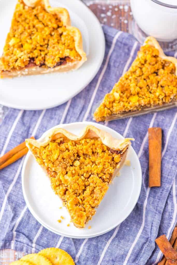 Top view of slice of pie with two slices of pie in the background.