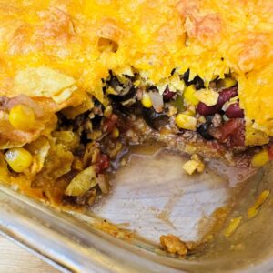 Top view of casserole with one serving missing.