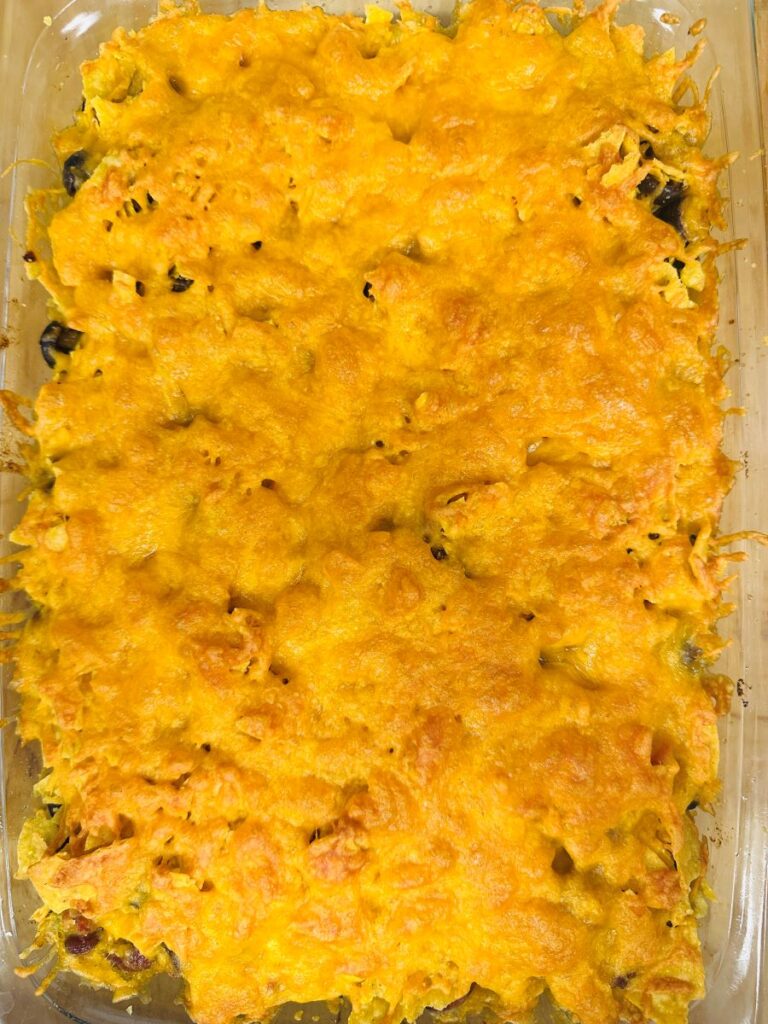 Top view of melted cheese on casserole in rectangular glass casserole dish.