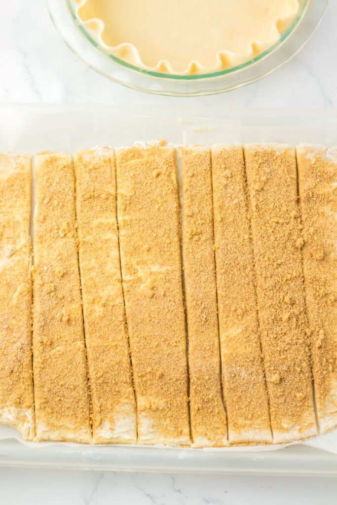 Top view of rectangular dough cut into 8 strips.