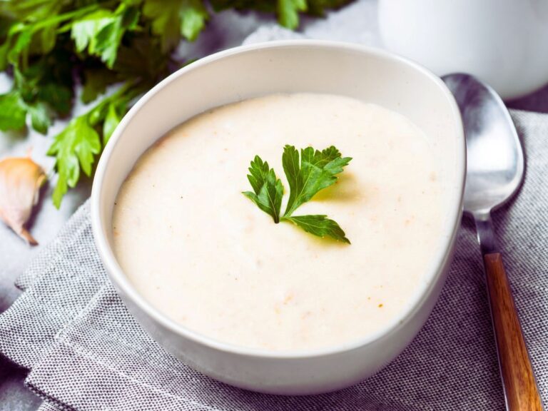 White bowl with cream-colored soup.