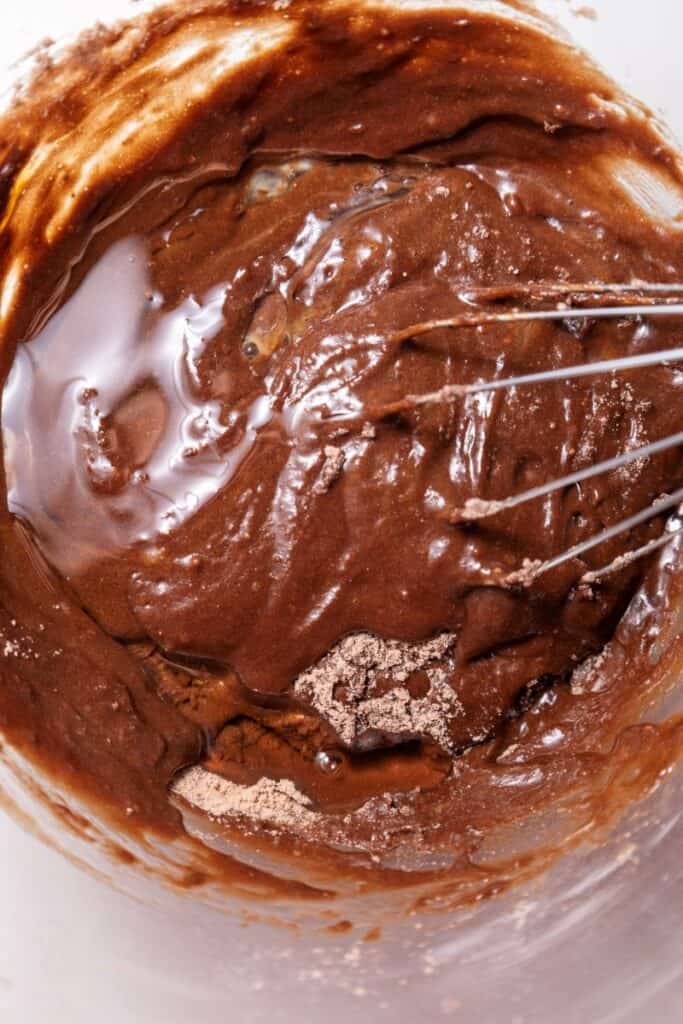 Whisk in brown batter with brown powder on edges.