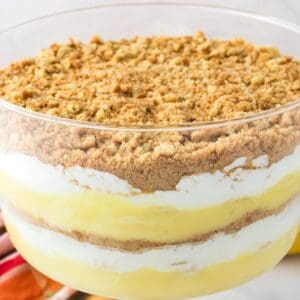 Close up of layered pudding in clear glass trifle bowl.