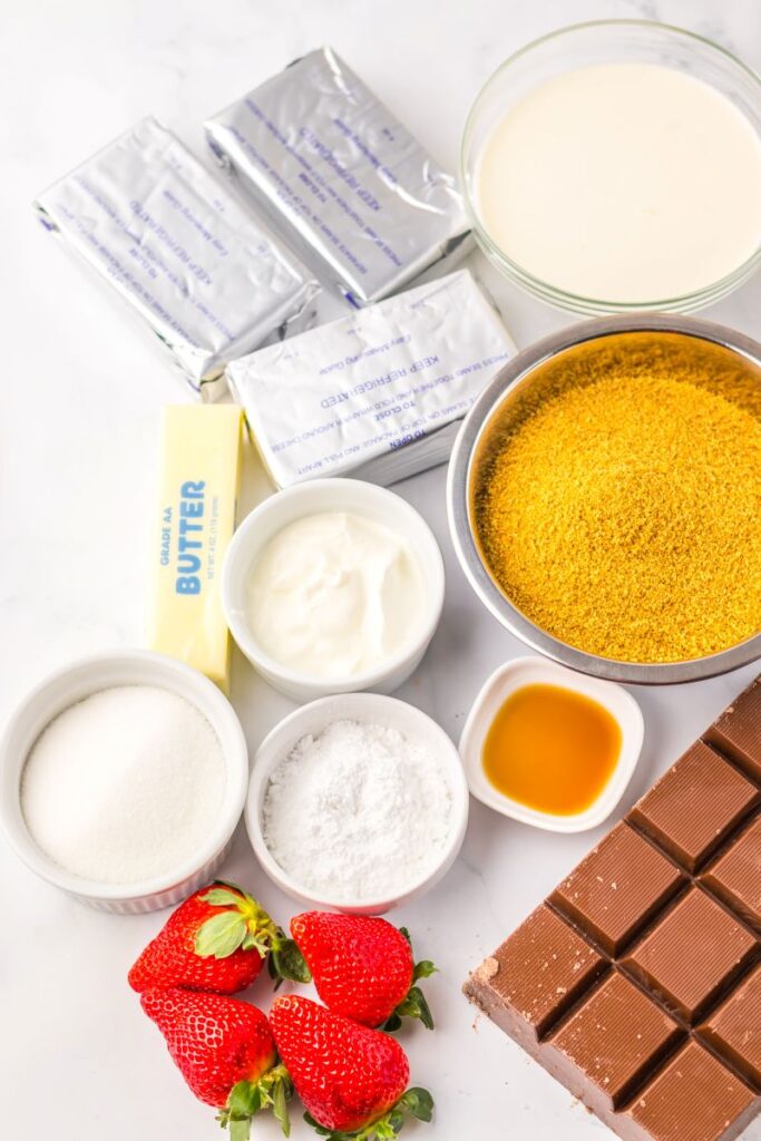 Overhead view of ingredients for chocolate covered strawberry cheesecake.