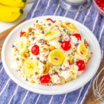 Overhead view of white bowl with banana split fluff salad.