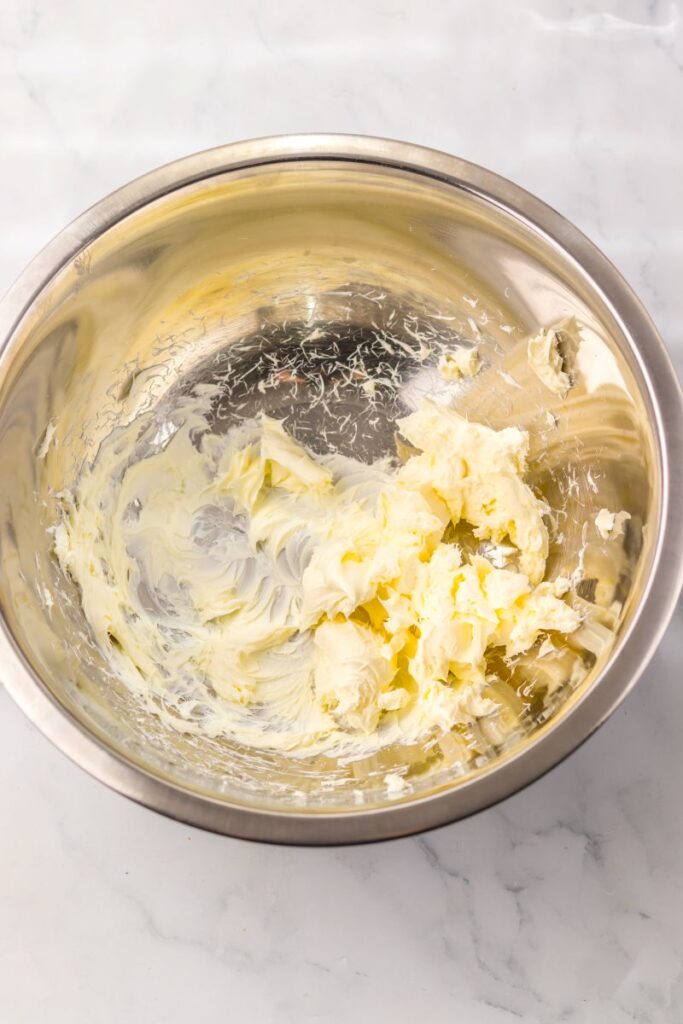 Whipped cream cheese in silver bowl.