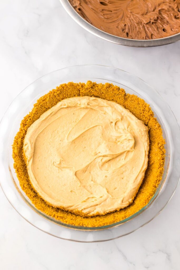 Graham cracker crust topped with creamy peanut butter mixture.