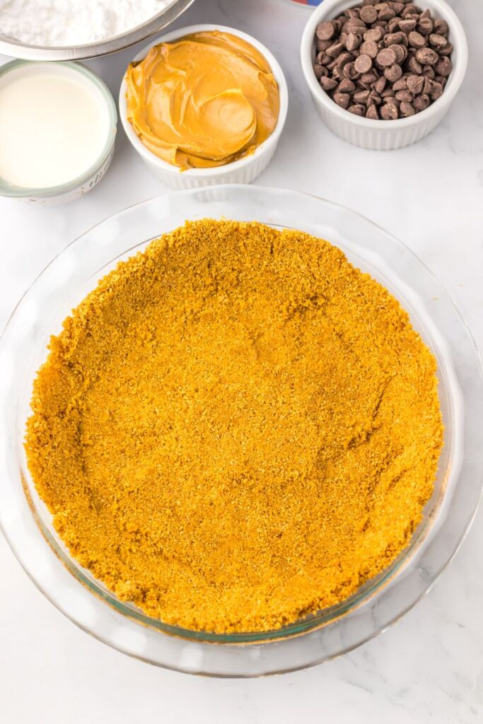 Graham cracker crust in glass pie plate.