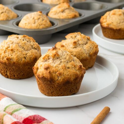 side view of white plate with three muffins.