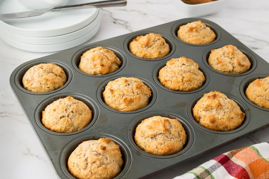 Muffin tin with cooked muffins.