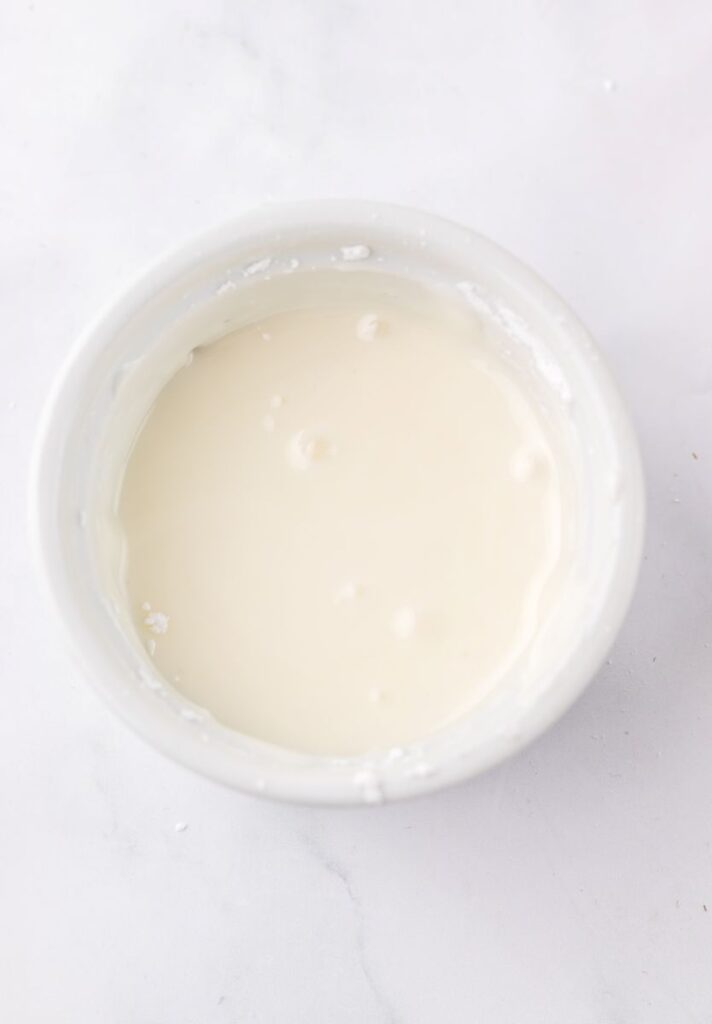 White liquid in white bowl.